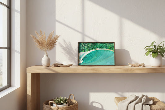 Artistic depiction of a wave with green and blue colors in a wooden frame.