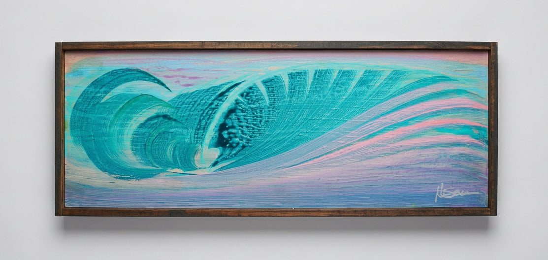 A framed horizontal canvas painting of a large turquoise and blue ocean wave with pink highlights, mounted on a light gray wall.