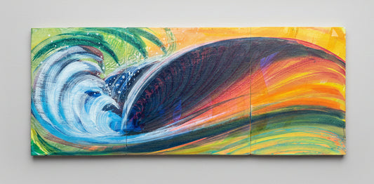 A rectangular hand-painted wooden wall art piece depicting a stylized ocean wave in vibrant colors, resting on a concrete floor.