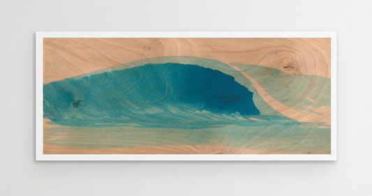 A rectangular wooden wall art piece featuring a stylized wave design in shades of teal and blue over a light natural wood grain background, shown hanging on a plain light gray wall.