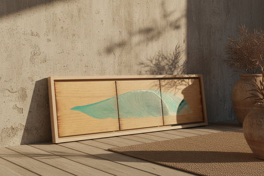A rectangular wooden wall art piece with three vertical panels, featuring a stylized teal-green wave design on a light wood background, shown against a plain light gray wall.