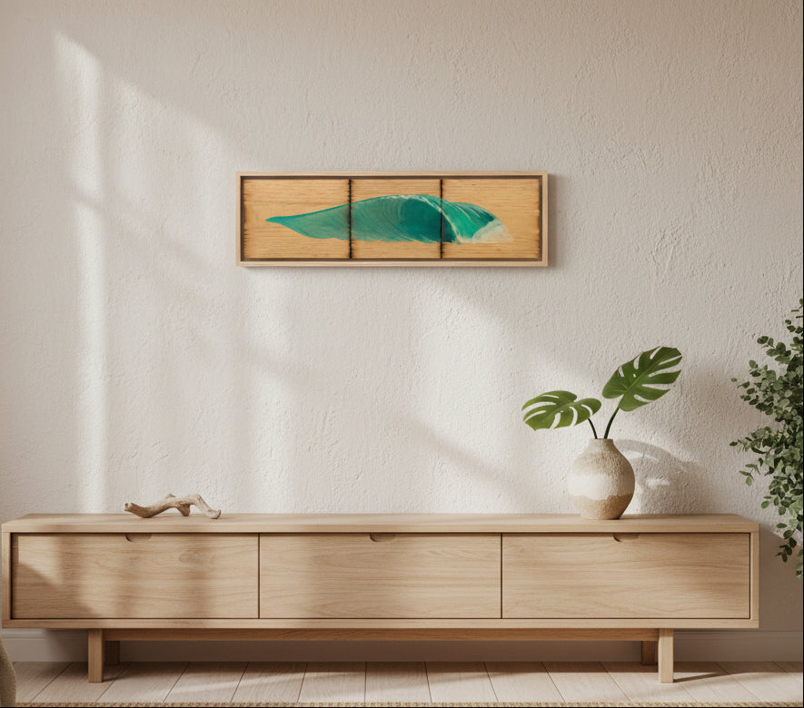 A rectangular wooden wall art piece with three vertical panels, featuring a stylized teal-green wave design on a light wood background, shown against a plain light gray wall.